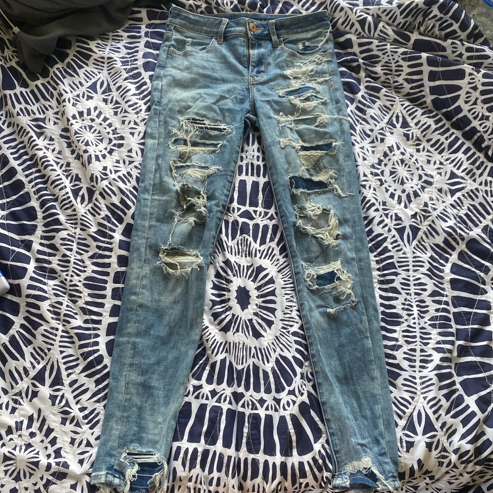 american skinny jeans wjth rips and patches